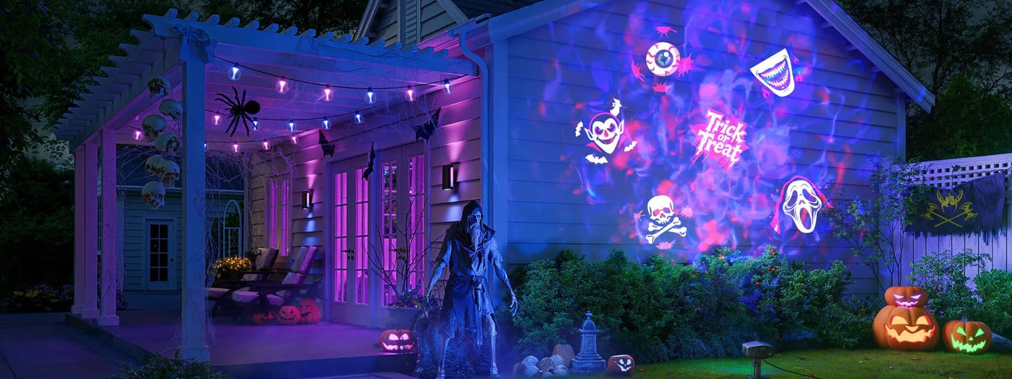 A projector turns a blank facade into the party backdrop, without covering the whole house.